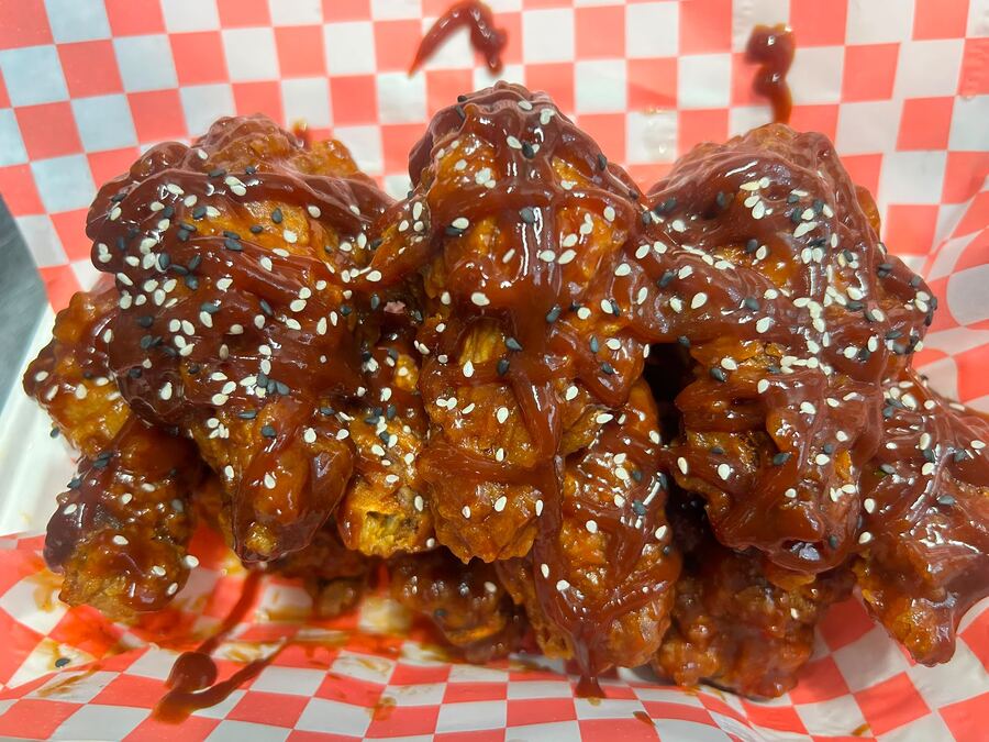 Barbe-fried wings glazed in sticky sauce with sesame seeds